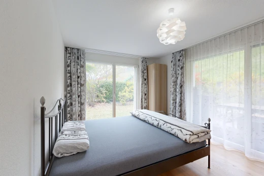 room / bedroom with light wood-style floors