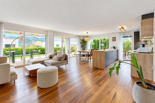 living / dining area with access to outside and wood finished floors