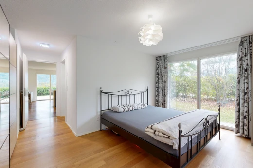 room / bedroom featuring light wood finished floors and access to exterior