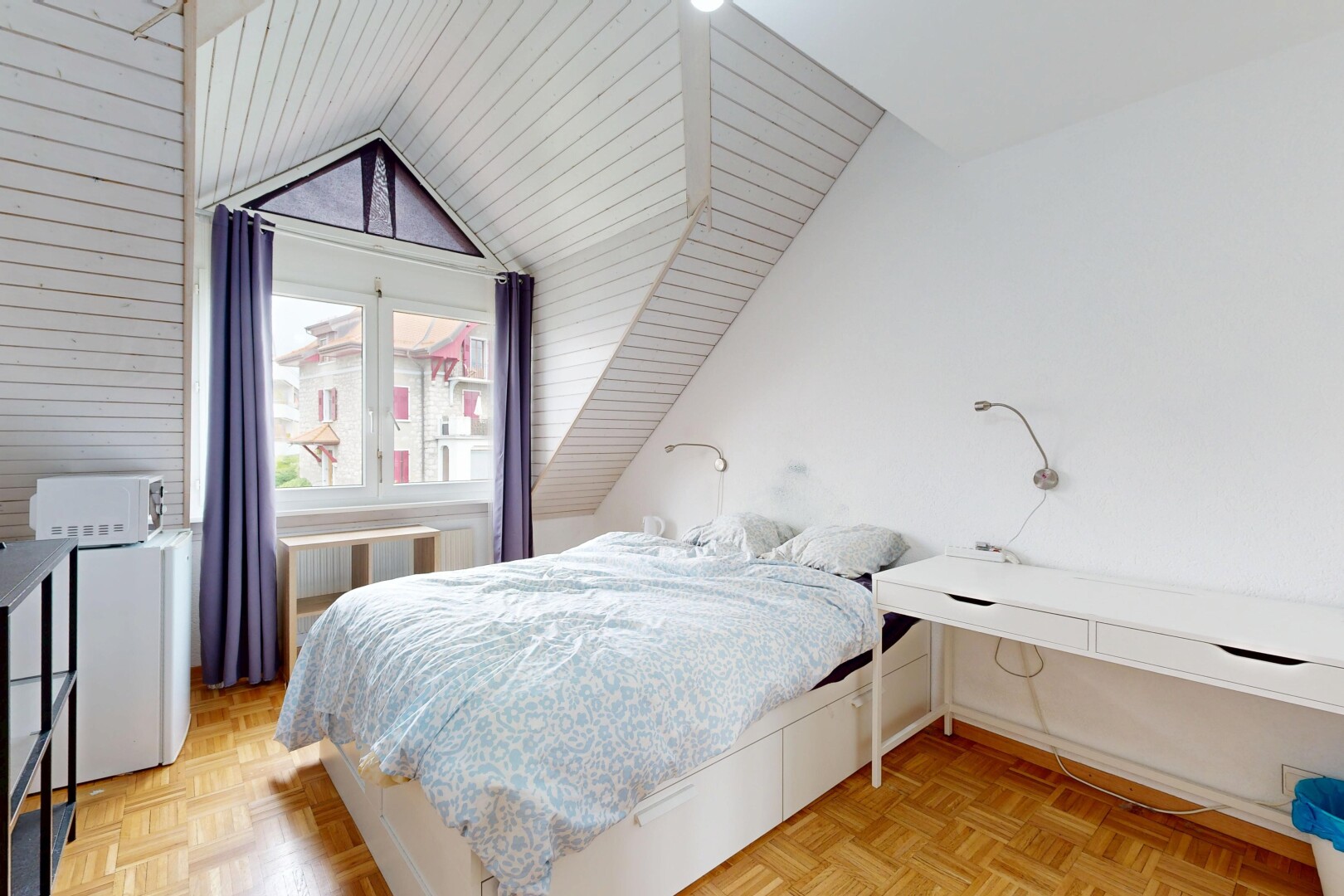 room featuring parquet flooring, vaulted ceiling, and radiator heating unit