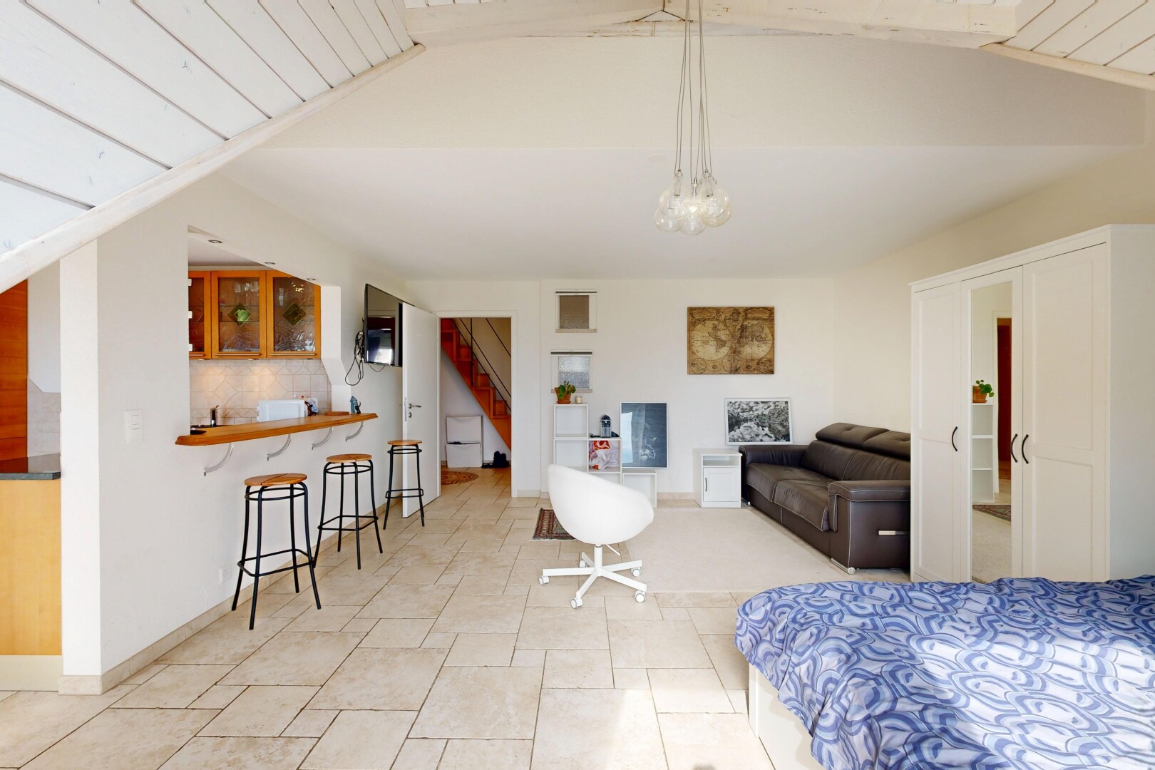 living room with stairs and a vaulted wood ceiling
