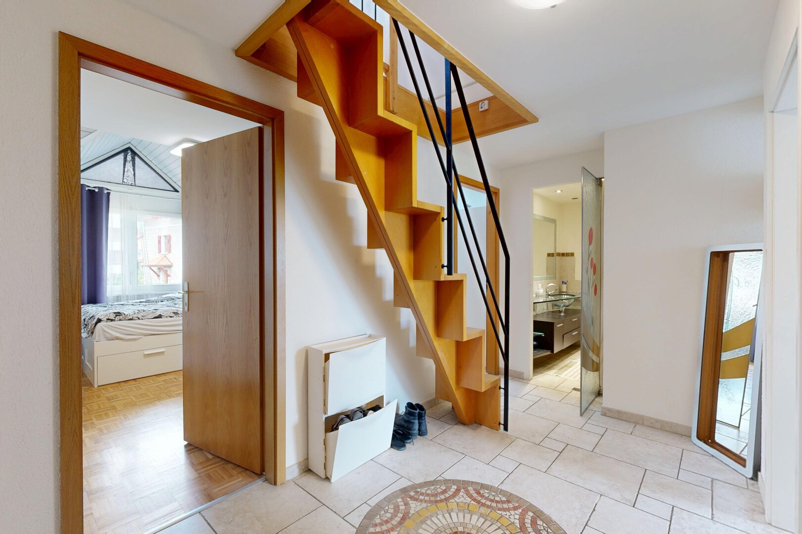 stairs featuring tile patterned flooring