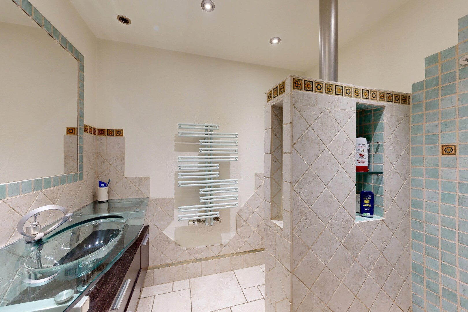 bathroom featuring vanity, tile walls, recessed lighting, light tile patterned floors, and radiator heating unit