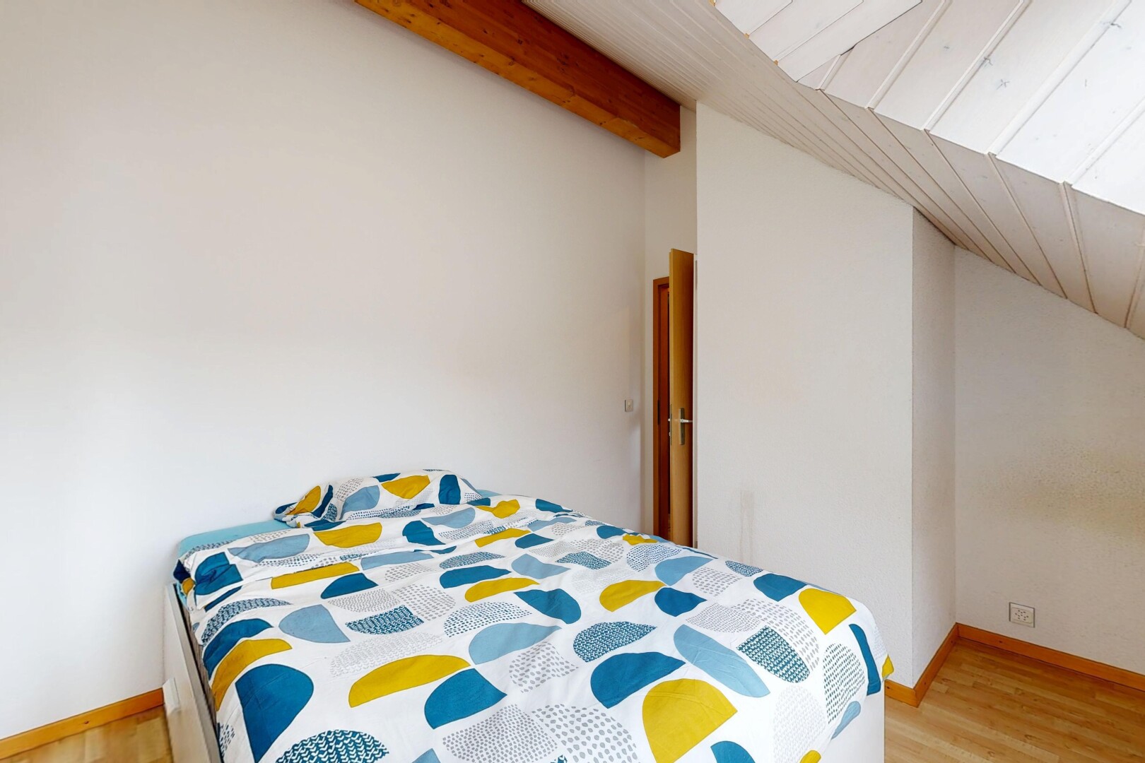 room / bedroom featuring lofted ceiling and light wood finished floors