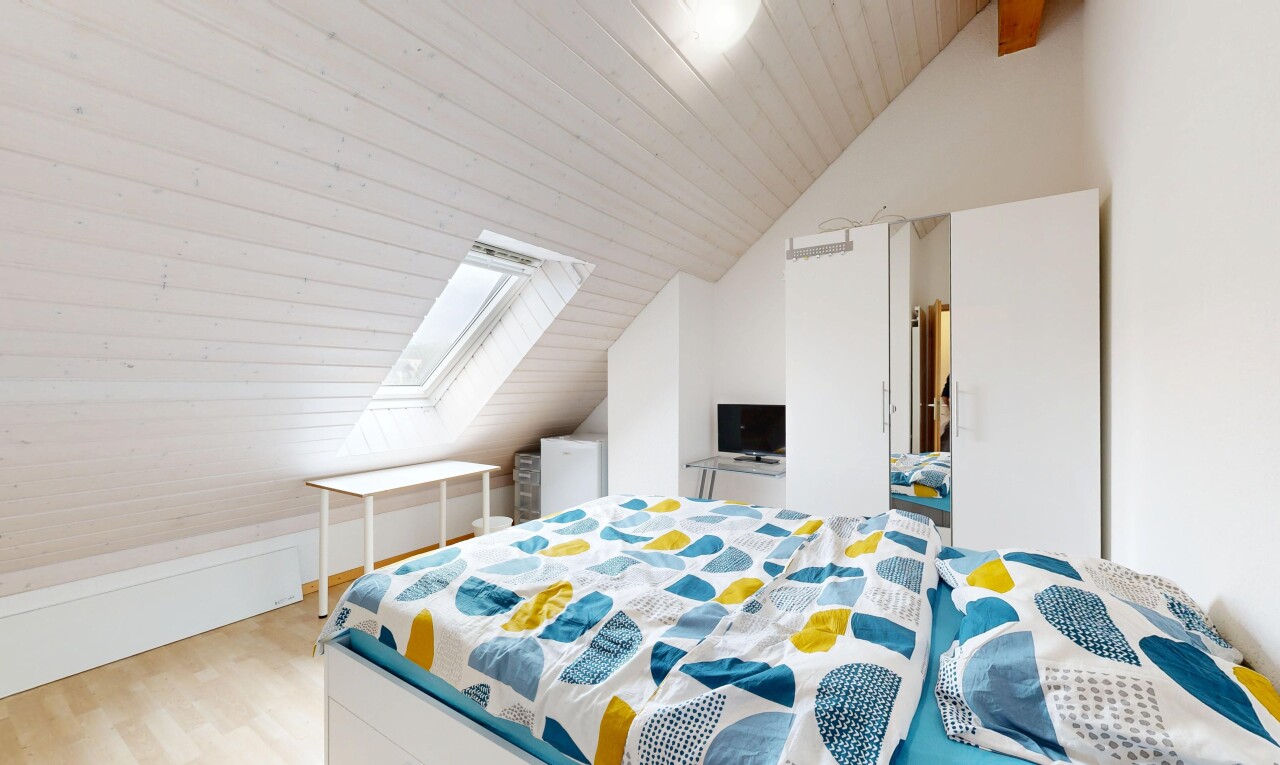 room with a vaulted wooden ceiling, light wood finished floors, and a skylight