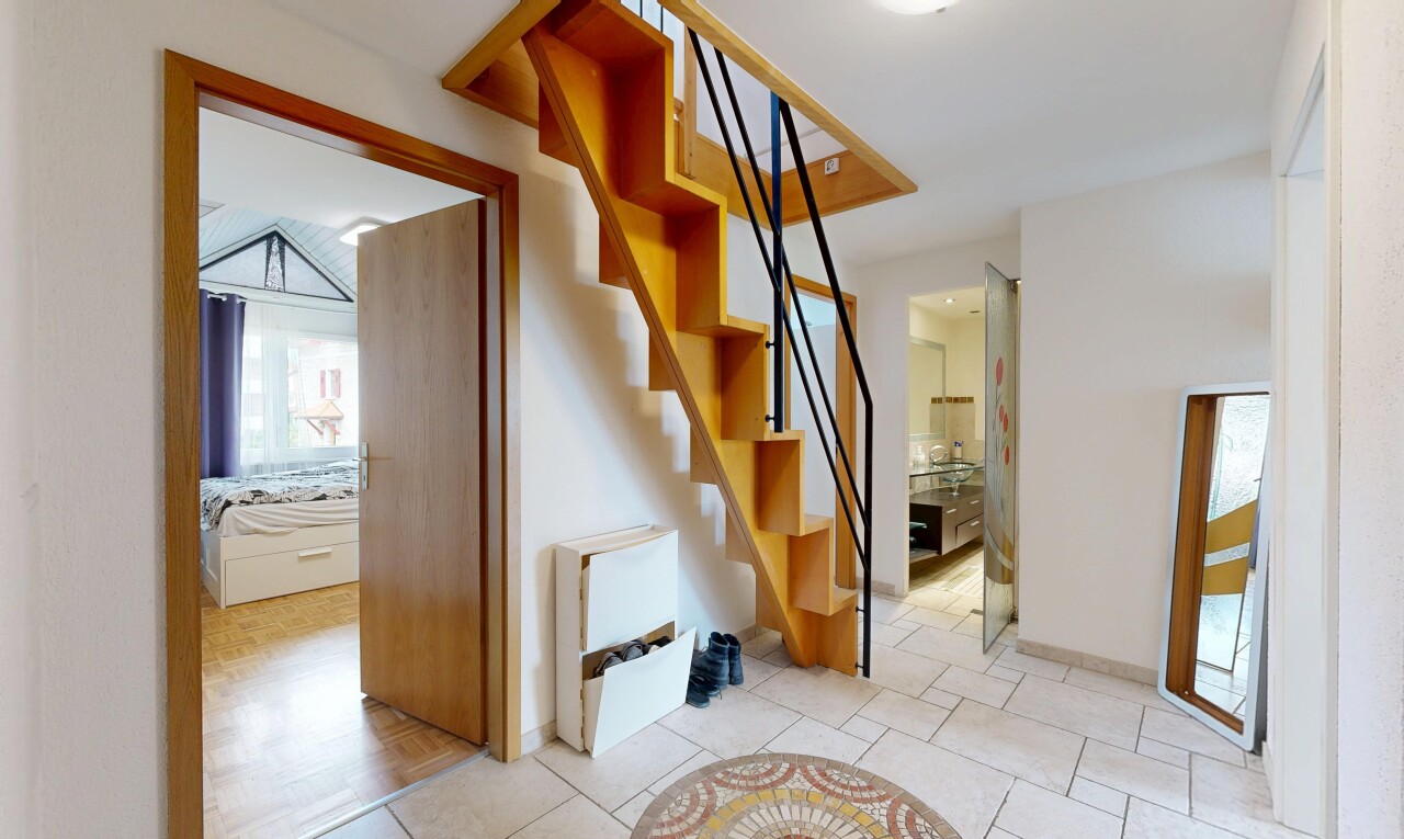stairs featuring tile patterned flooring