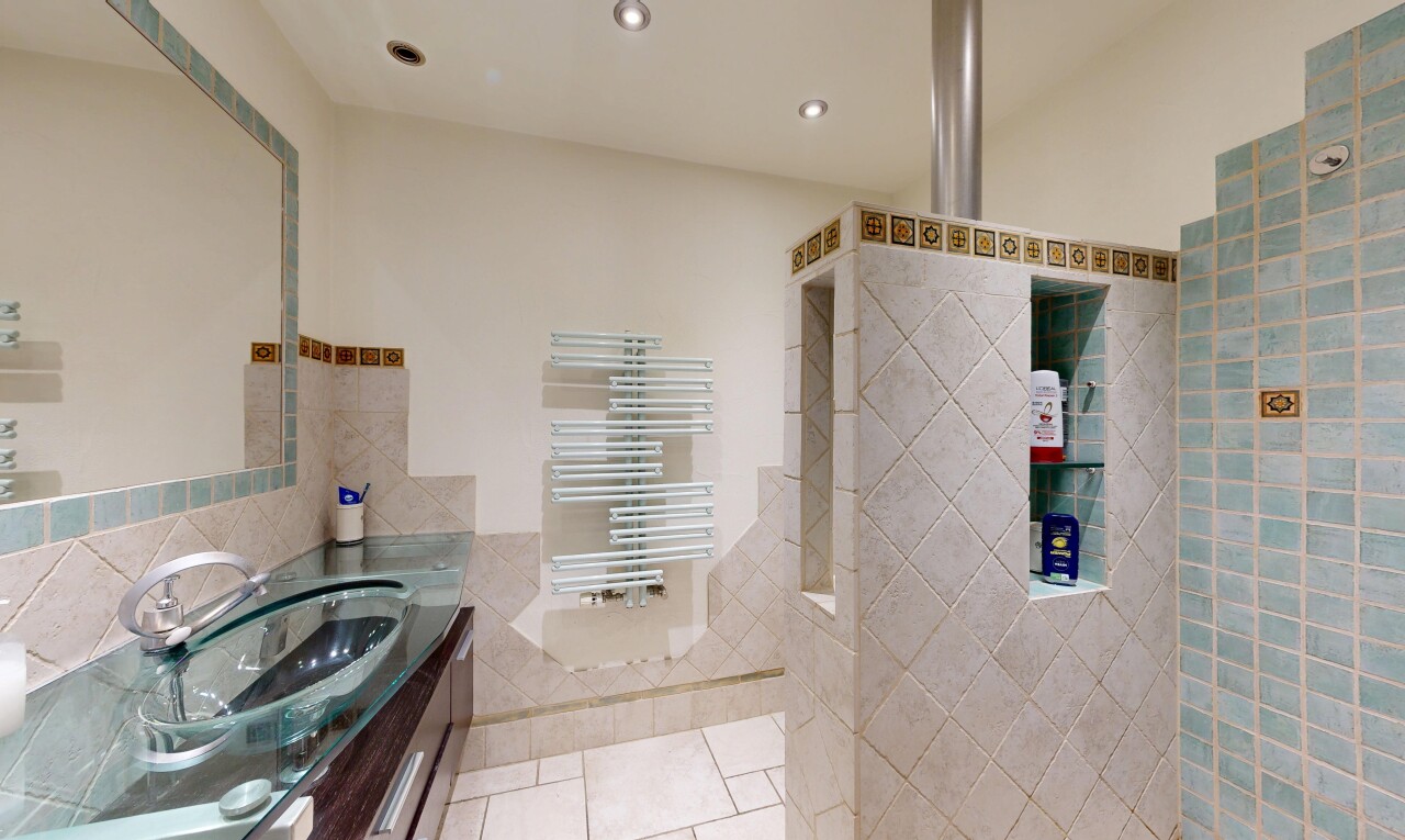 bathroom featuring vanity, tile walls, recessed lighting, light tile patterned floors, and radiator heating unit
