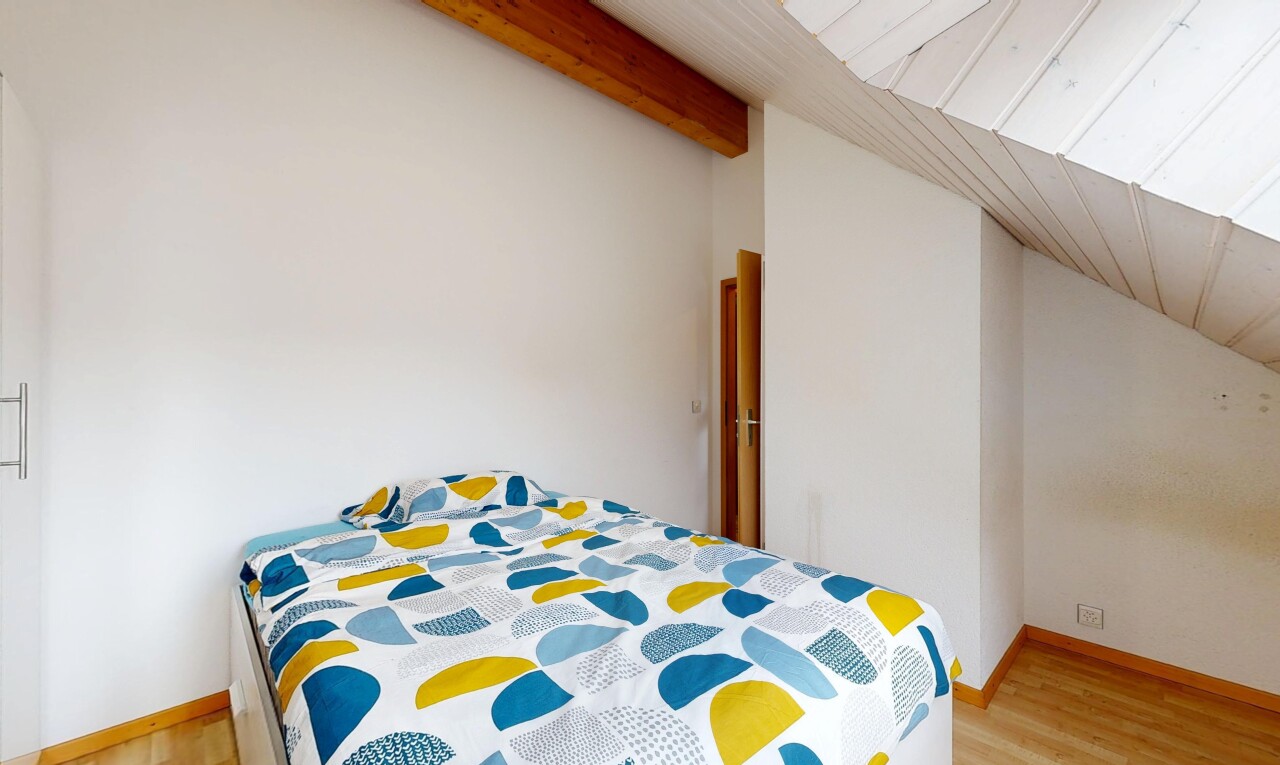 room / bedroom featuring lofted ceiling and light wood finished floors