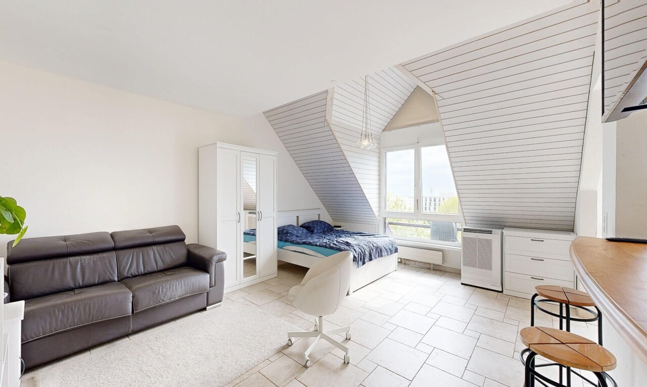room / bedroom with lofted ceiling and light tile patterned floors