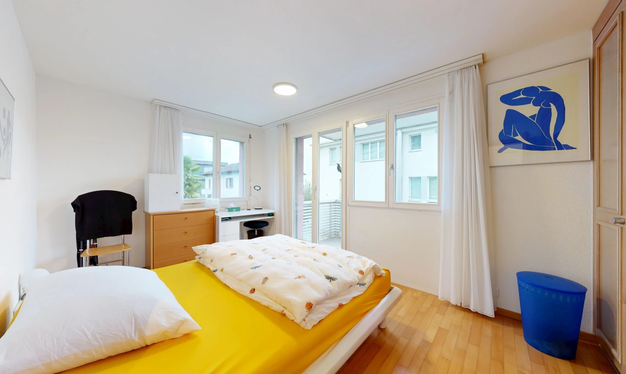 room / bedroom with light wood finished floors, access to outside, and multiple windows