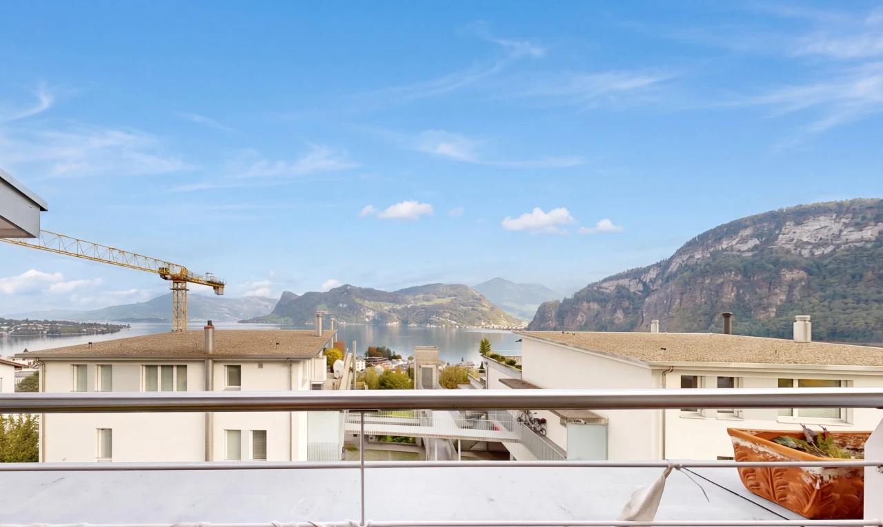 view of property featuring a water and mountain view