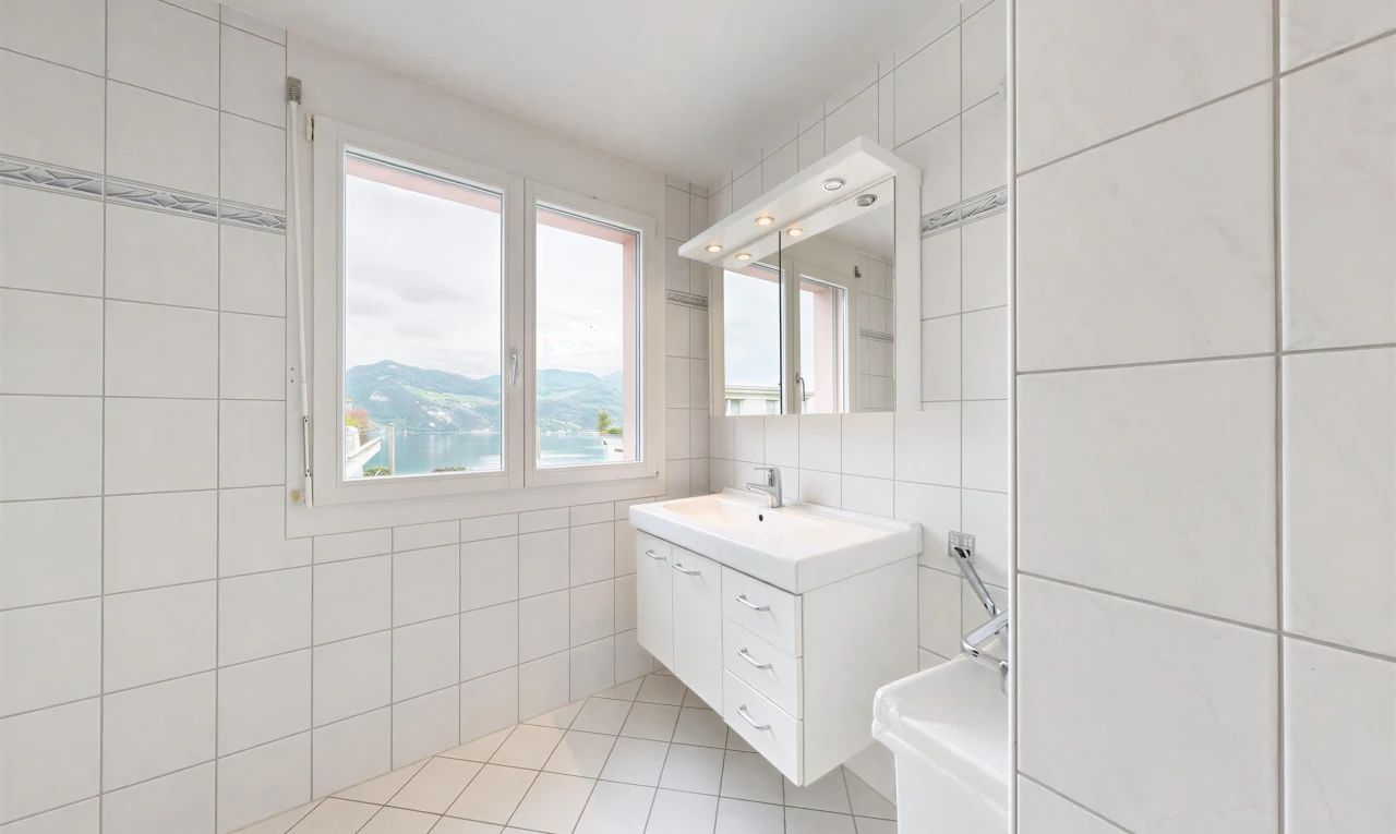 bathroom featuring tile walls, vanity, and light tile patterned floors