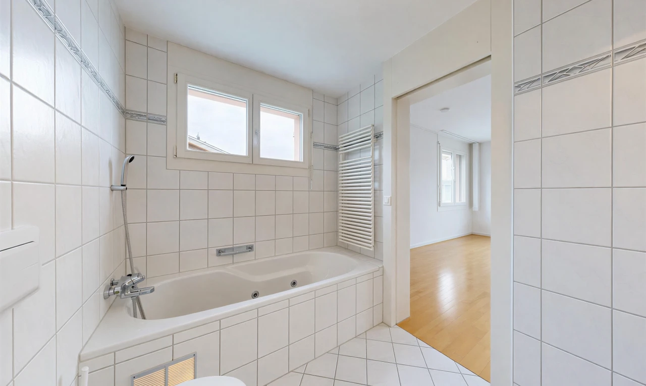 full bathroom featuring radiator, light tile patterned floors, and tile walls