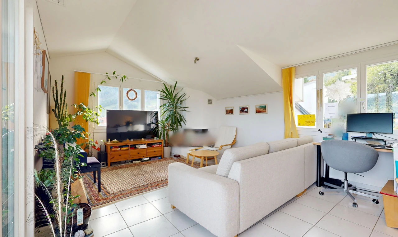 living room with an office area, lofted ceiling, and light tile patterned flooring