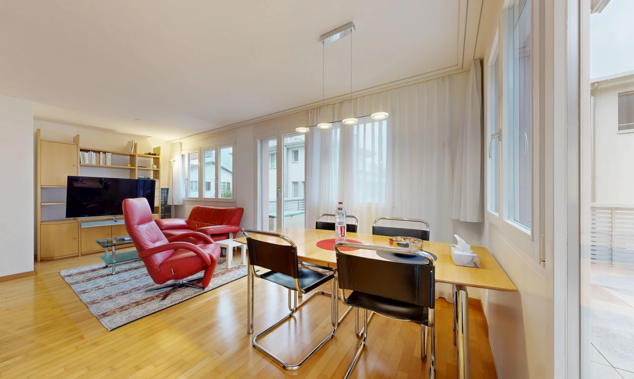living / dining area with light wood-style floors