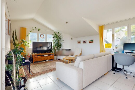 living room with an office area, lofted ceiling, and light tile patterned flooring