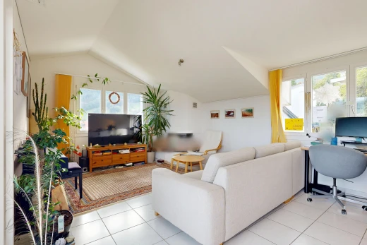 living room with an office area, lofted ceiling, and light tile patterned flooring