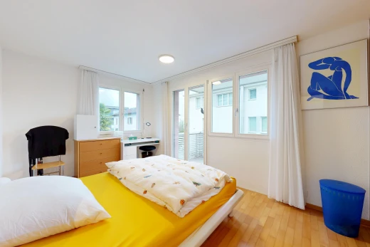 room / bedroom with light wood finished floors, access to outside, and multiple windows