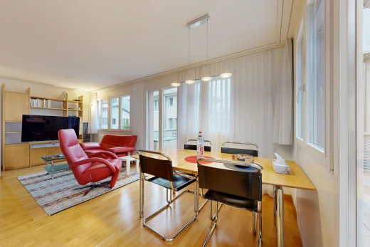 living / dining area with light wood-style floors