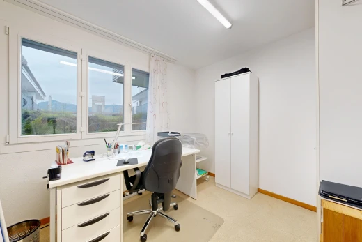 office space featuring light carpet and baseboards