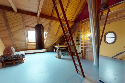 unfurnished room featuring lofted ceiling with beams, concrete floors, and wooden ceiling