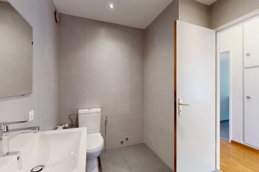 bathroom featuring tile walls, recessed lighting, and light tile patterned floors