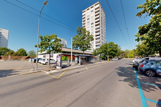 view of property featuring street lights and curbs