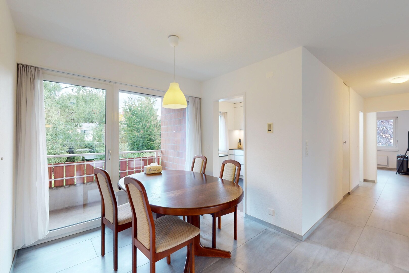 dining area with light tile patterned floors and baseboards