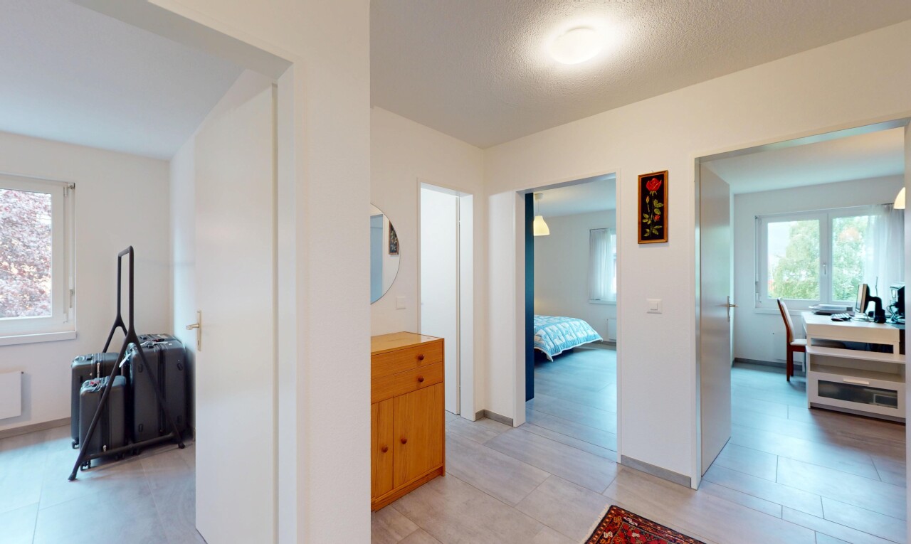 corridor featuring baseboards