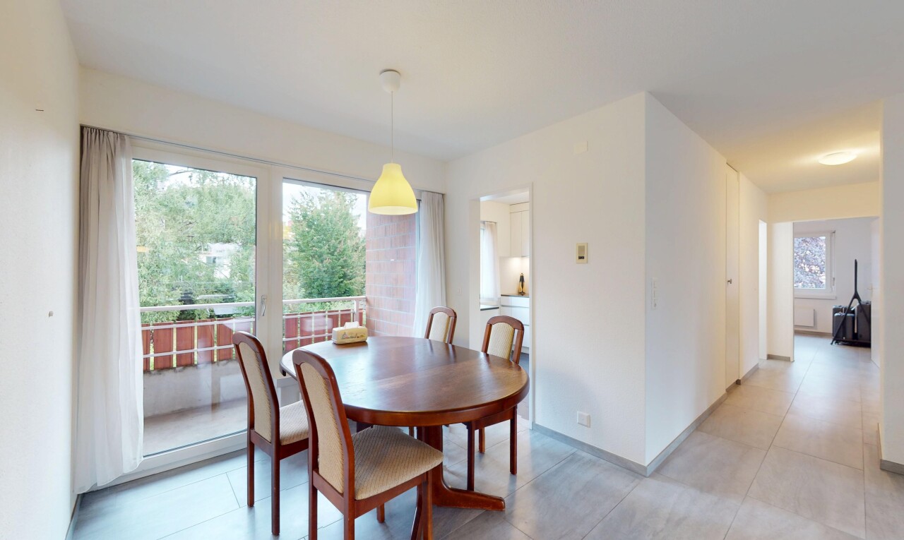 dining area with light tile patterned floors and baseboards