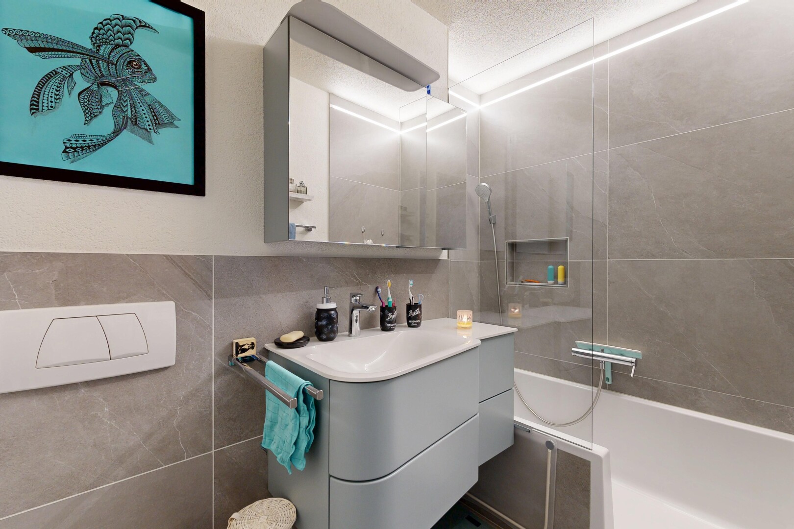 full bathroom featuring vanity and tile walls