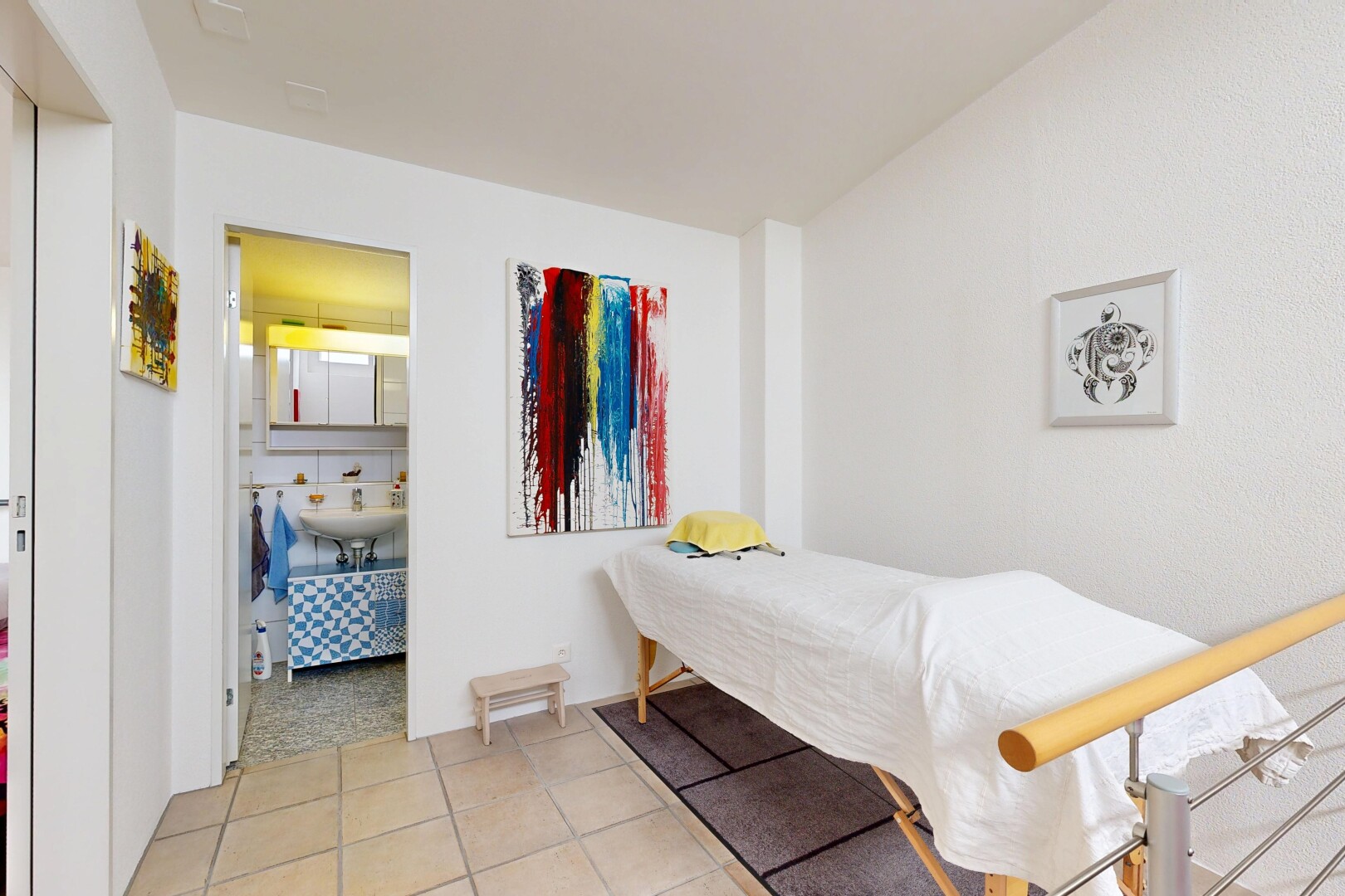 room / bedroom with light tile patterned floors and ensuite bathroom
