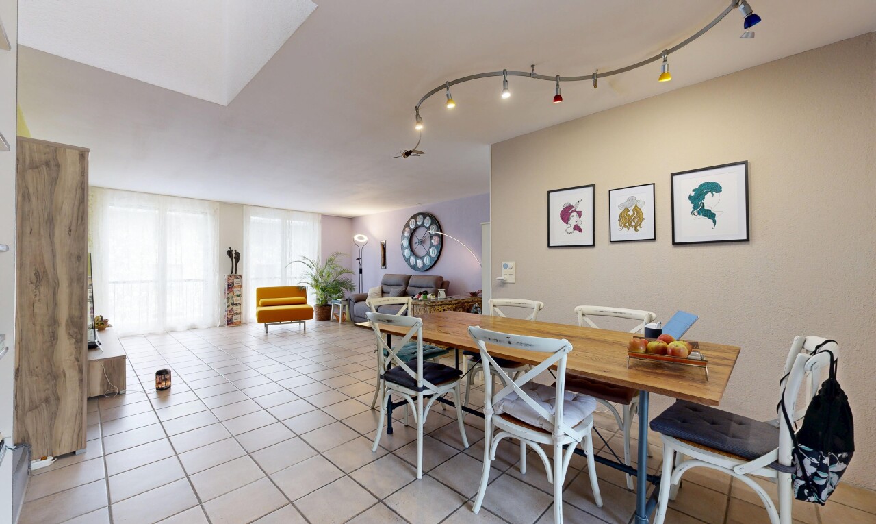 dining room featuring light tile patterned floors and track lighting
