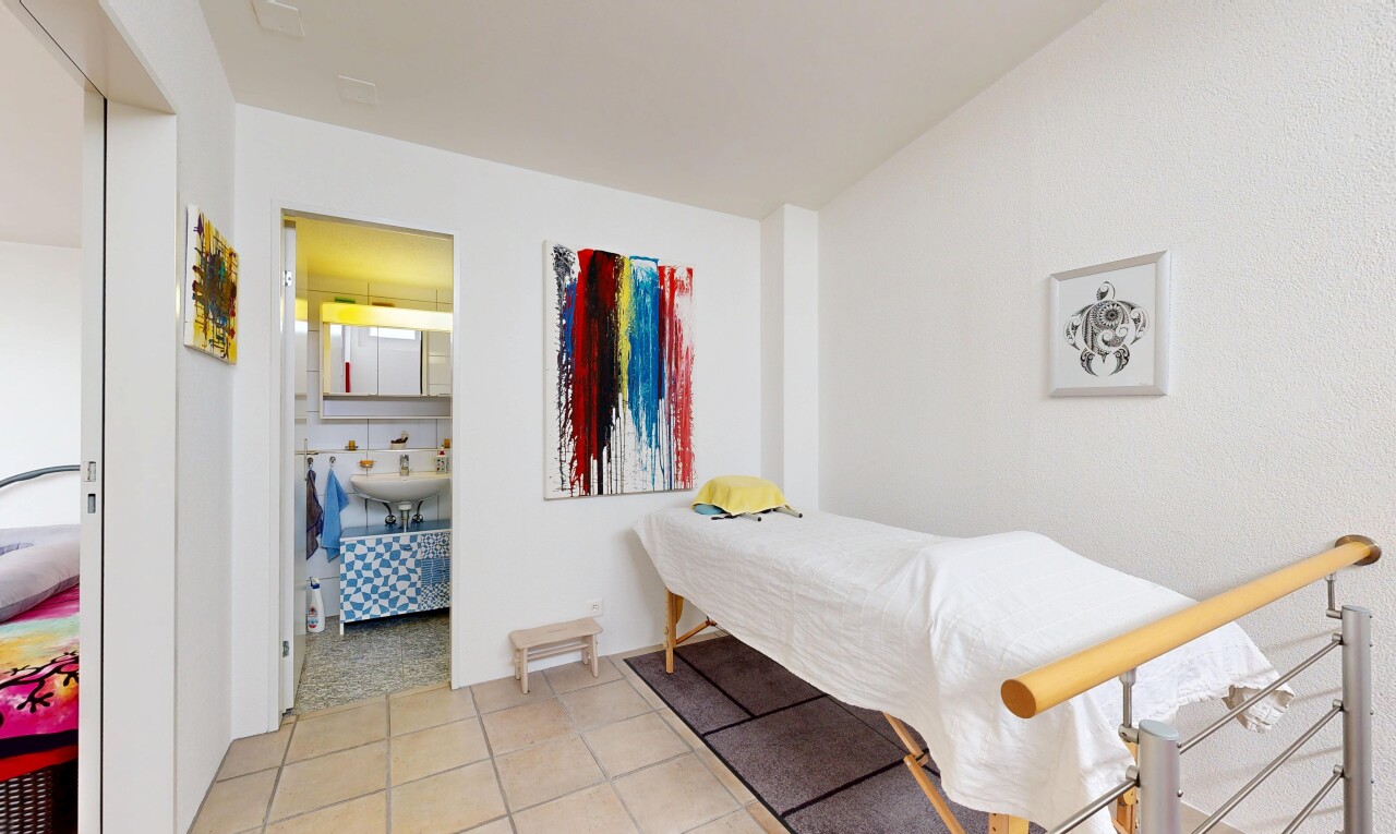 room / bedroom with light tile patterned floors and ensuite bathroom