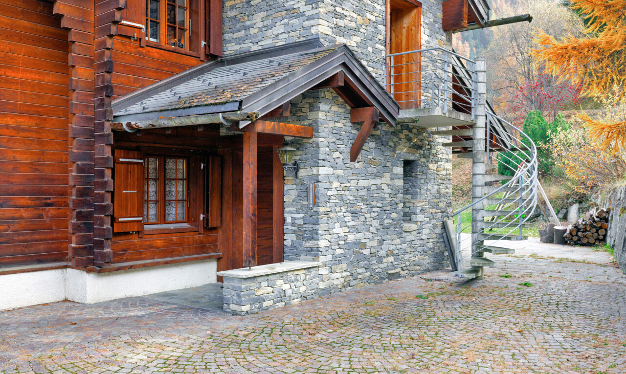 view of home with stone siding