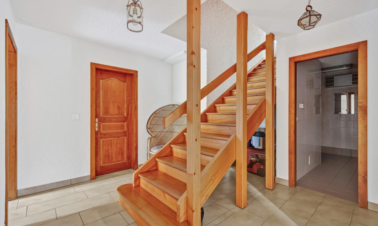 staircase with a sauna and baseboards