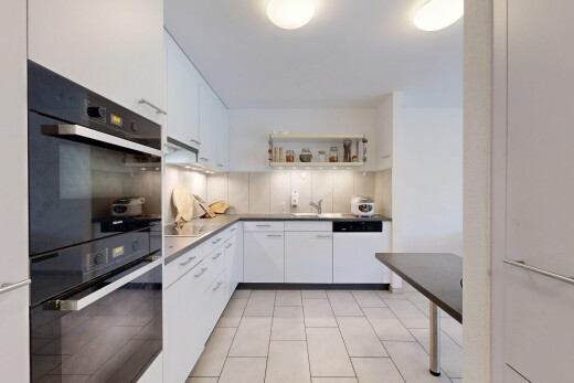cuisine avec light floor, four double, white cabinets, armoires blanches, et inside property