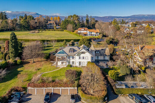 view of home featuring a lawn and a mountain view