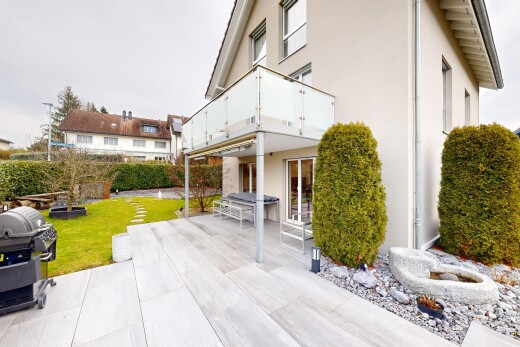 außenansicht mit overcast, terrasse, balkon, stuckverkleidung, und rasen