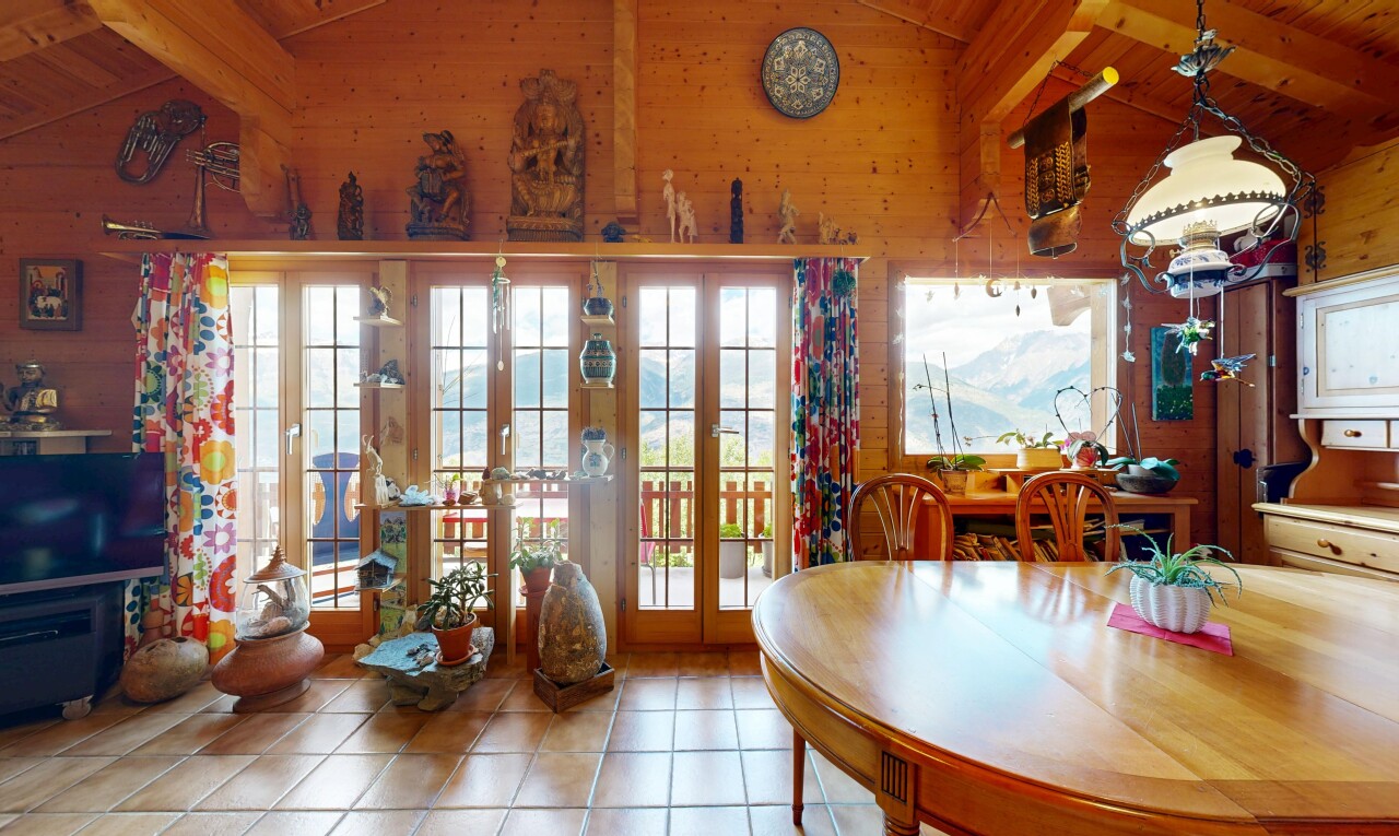 tiled dining room featuring lofted ceiling with beams, french doors, and wood walls