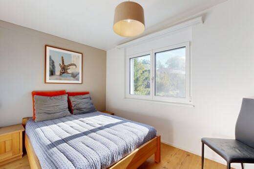 room featuring pendant lighting and light wood finished floors