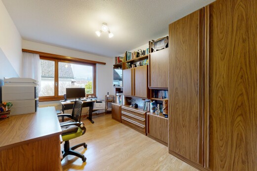 büro mit light floor, bürobereich, fernseher, inside property, und natürliches licht