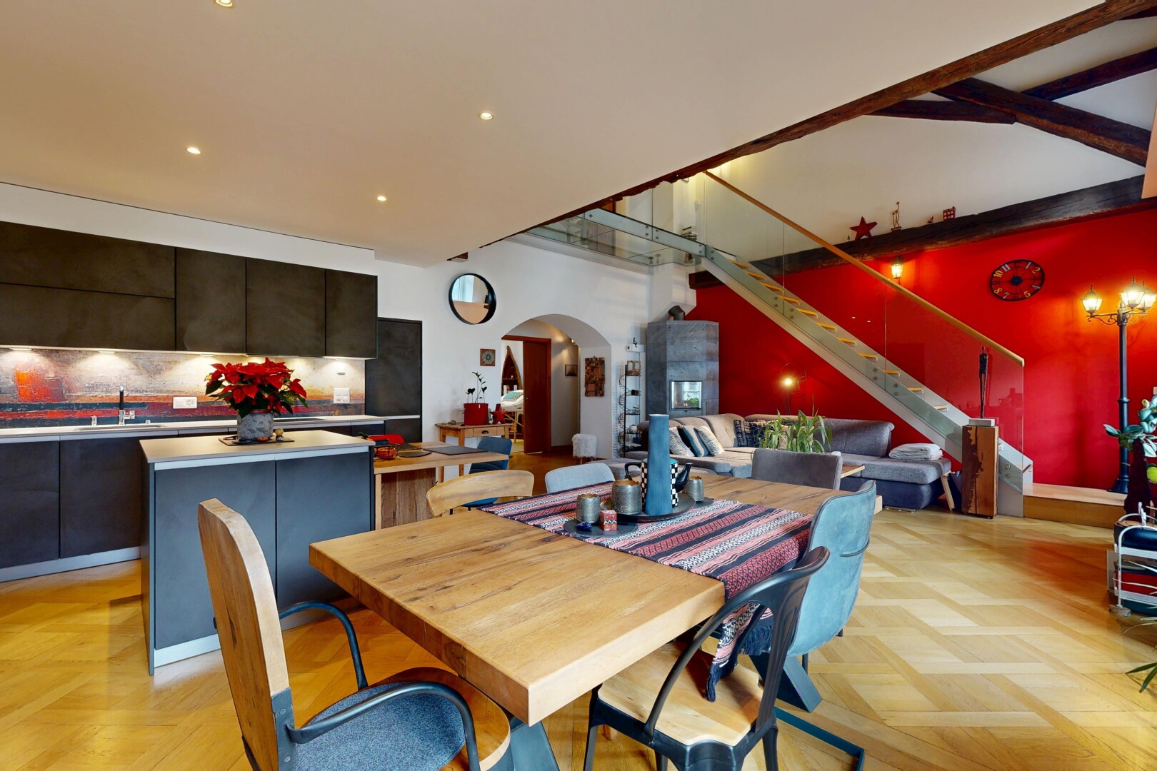 dining area featuring arched walkways, recessed lighting, and stairway