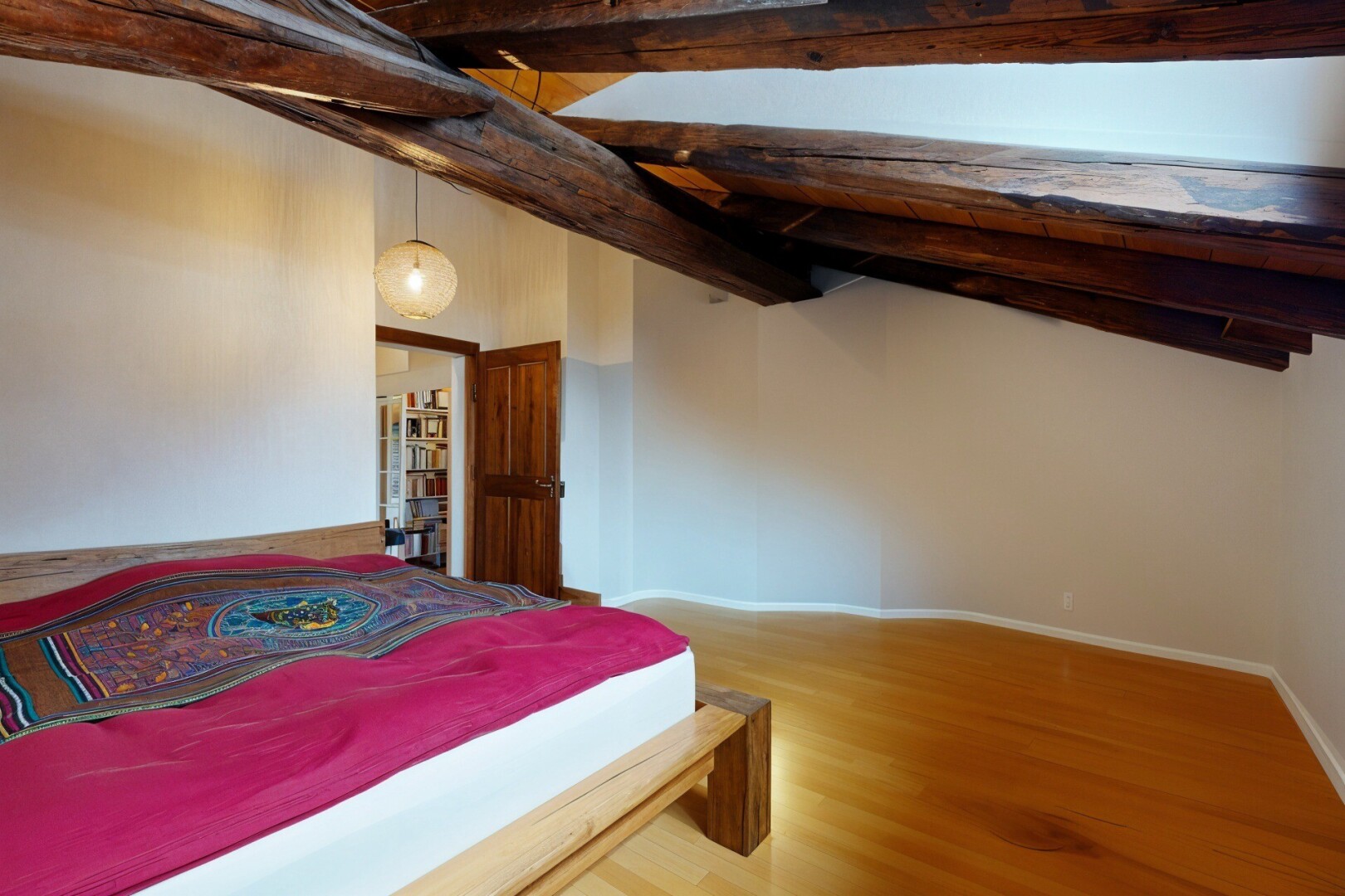 room / bedroom with wood finished floors and baseboards