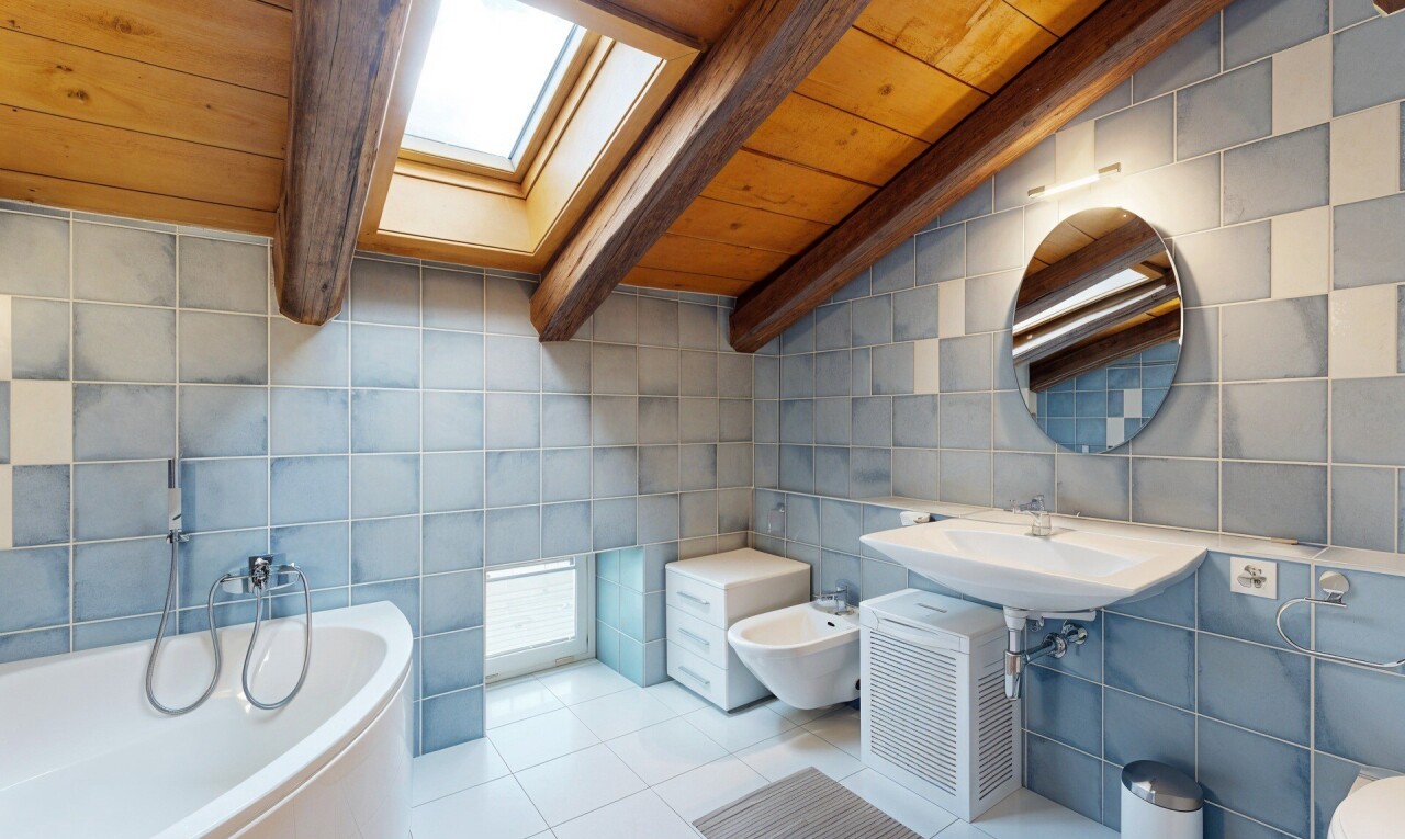 full bath featuring wooden ceiling, a garden tub, tile walls, tile patterned flooring, and a skylight