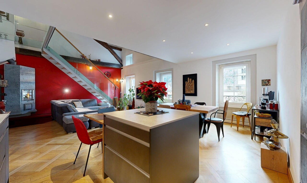 kitchen featuring light countertops, a center island, recessed lighting, and open floor plan