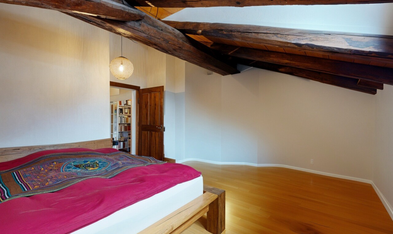 room / bedroom with wood finished floors and baseboards