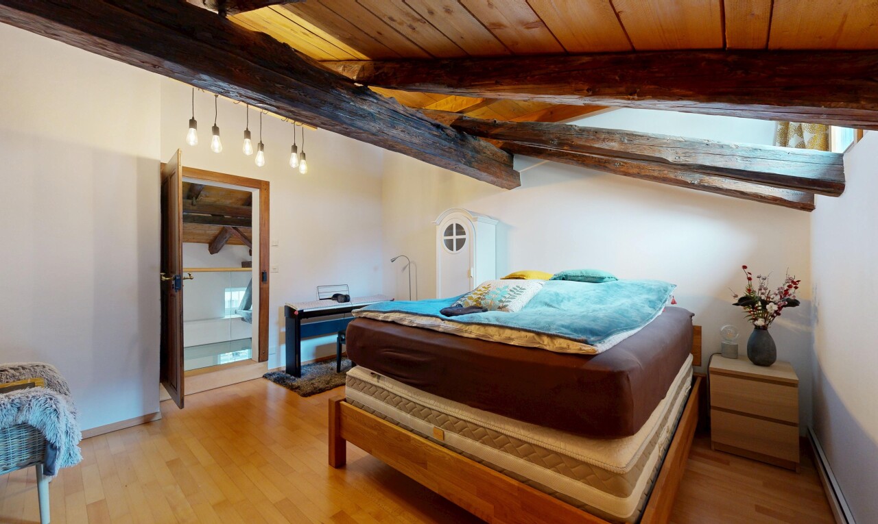 room with wooden ceiling and light wood finished floors