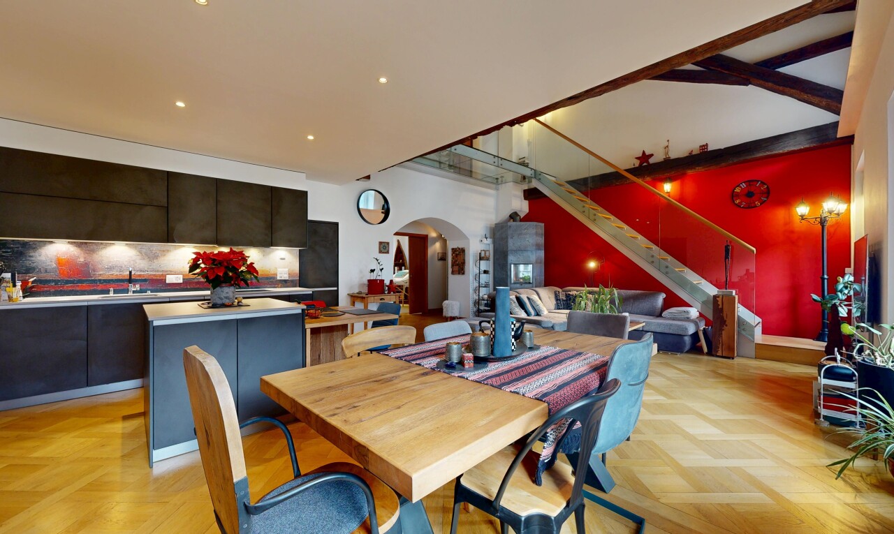 dining area featuring arched walkways, recessed lighting, and stairway