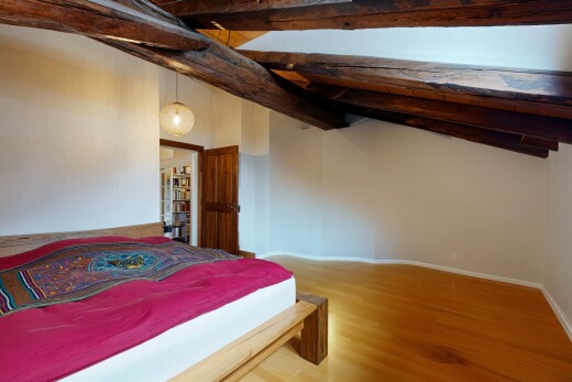 room / bedroom with wood finished floors and baseboards